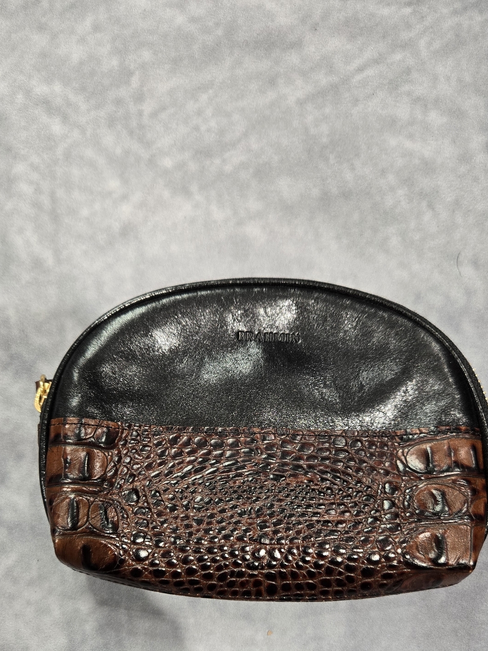 Brahmin leather cosmetic pouch, often identified in the brand's vintage collecti